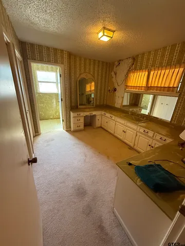 a view of a kitchen with a sink and a dishwasher