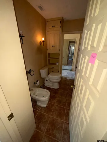 a bathroom with a sink and toilet