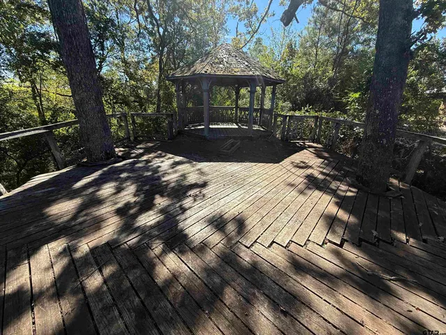 a view of balcony with wooden floor and outdoor space