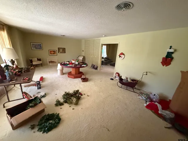 a view of a room with furniture and toys