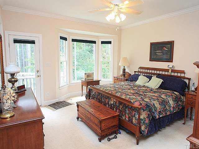 13917 Possum Track Road Raleigh, NC 27614 - Photo 10 of 12 The master bedroom on the first floor has a charming bay window overlooking the pretty back yard. His & hers closets! It The master bath has a whirlpool tub and separate shower. Master Suite
