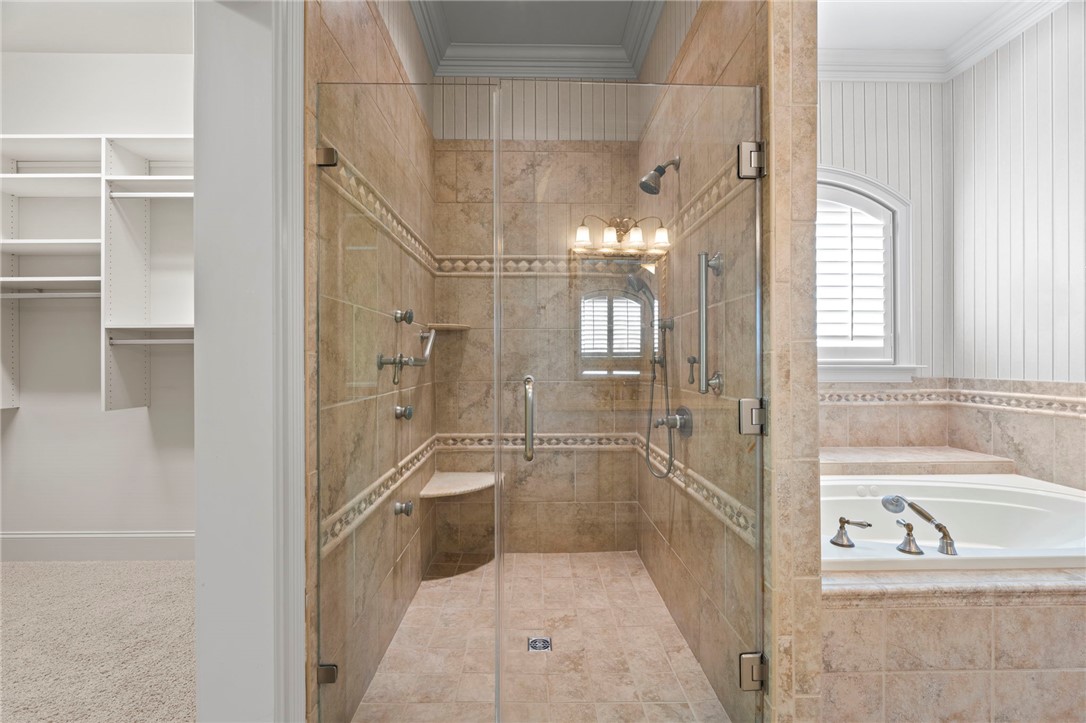 114 Willowbend Drive Anderson, SC 29621 - Photo 23 of 50 This serene bathroom offers a spacious walk-in shower and a relaxing soaking tub.