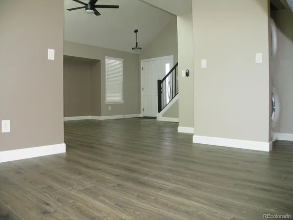 a view of a livingroom with wooden floor