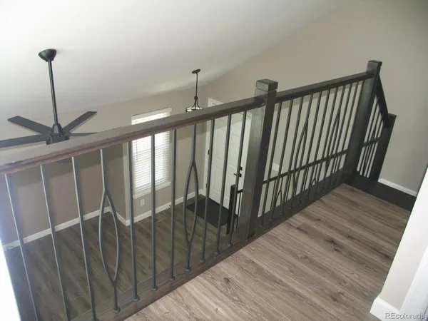 a view of a balcony with a ceiling fan