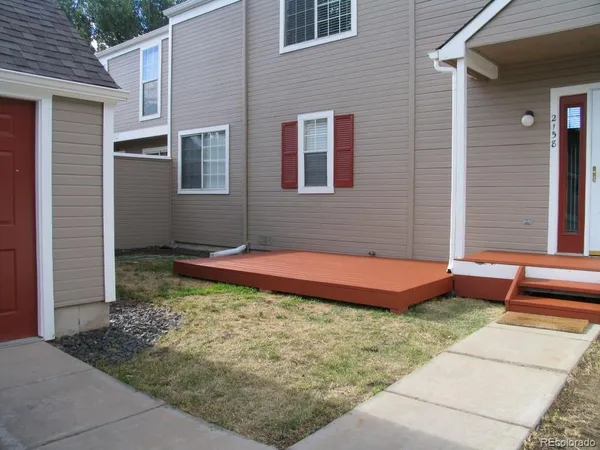 a view of a backyard with a table and chair
