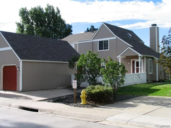 a view of a house with a yard and plants