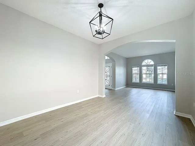a kitchen with granite countertop a sink and cabinets