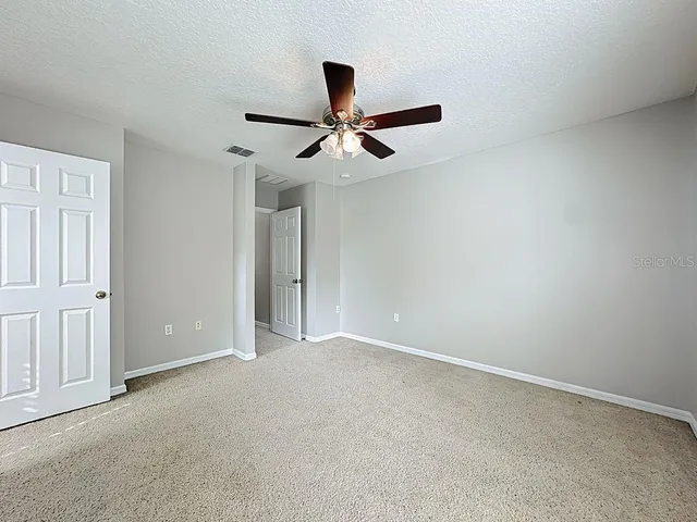 an aerial view of residential houses with outdoor space and swimming pool
