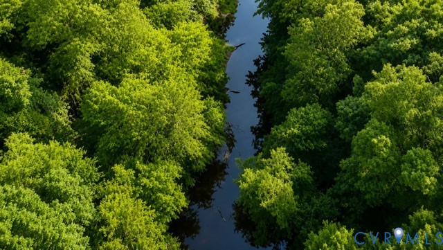 Aerial landscape featuring a winding river bordere