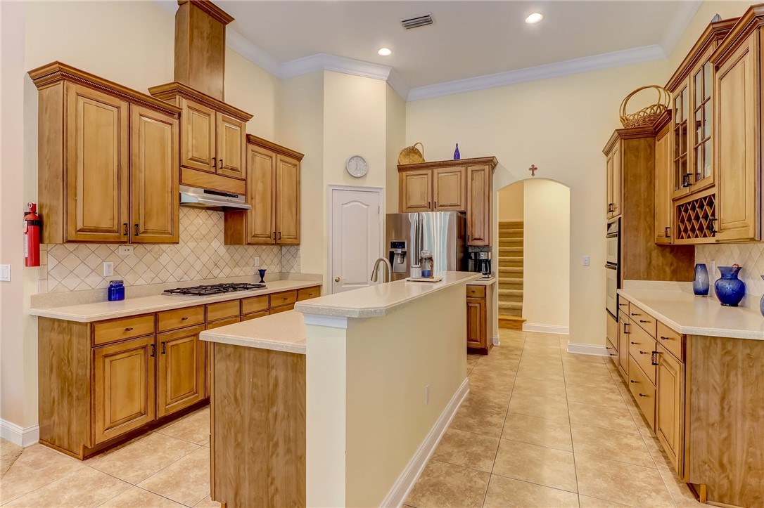 96411 Blackrock Road Yulee, FL 32097 - Photo 12 of 34 a kitchen with stainless steel appliances a sink stove and refrigerator