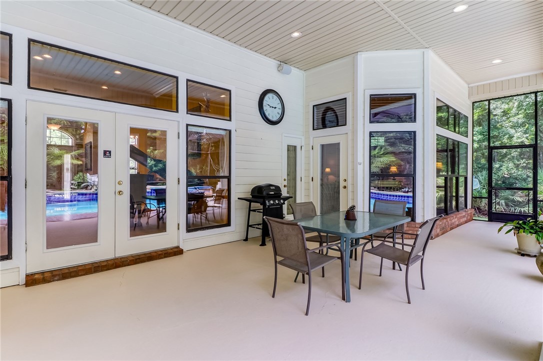 96411 Blackrock Road Yulee, FL 32097 - Photo 15 of 34 a view of a dining room with furniture and chandelier