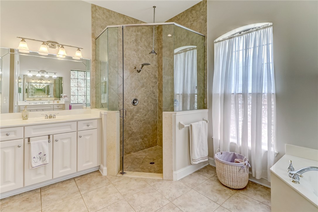 96411 Blackrock Road Yulee, FL 32097 - Photo 19 of 34 a bathroom with a granite countertop sink and a mirror