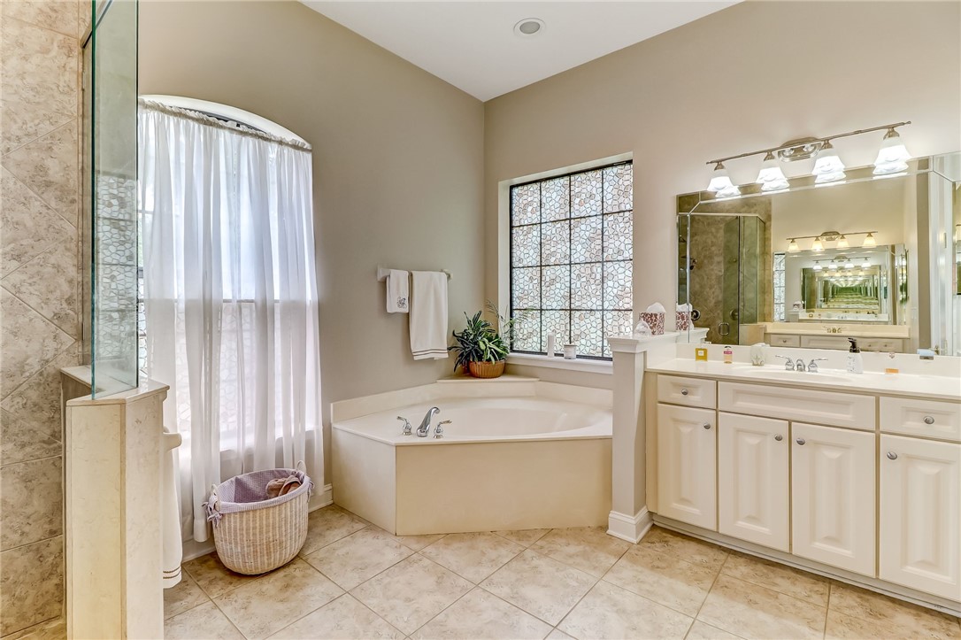 96411 Blackrock Road Yulee, FL 32097 - Photo 20 of 34 a spacious bathroom with a tub sink and mirror