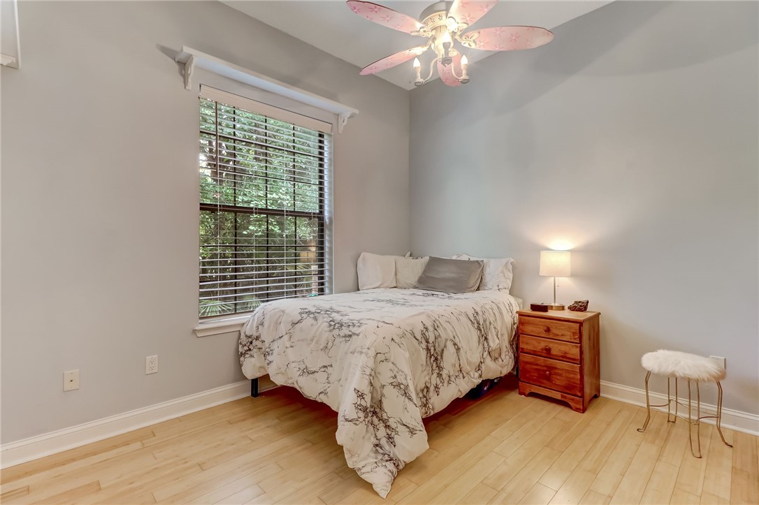 96411 Blackrock Road Yulee, FL 32097 - Photo 23 of 34 a bed sitting in a bedroom next to a window