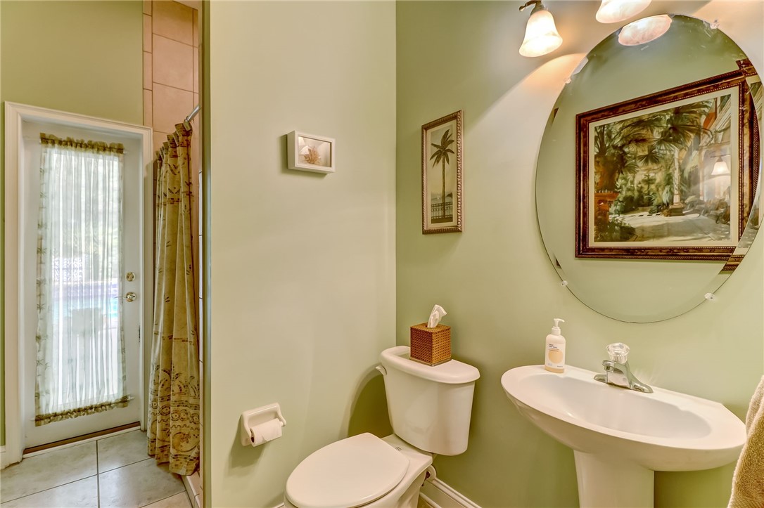 96411 Blackrock Road Yulee, FL 32097 - Photo 24 of 34 a bathroom with a toilet sink and mirror