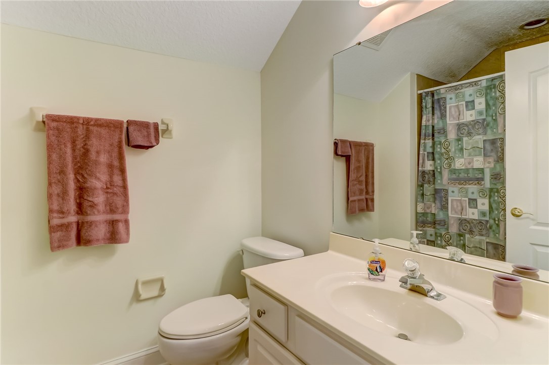 96411 Blackrock Road Yulee, FL 32097 - Photo 27 of 34 a bathroom with a sink a toilet and shower