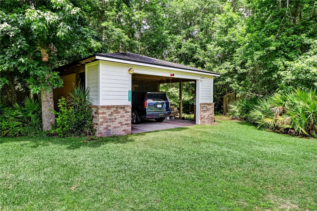96411 Blackrock Road Yulee, FL 32097 - Photo 31 of 34 a view of a house with backyard