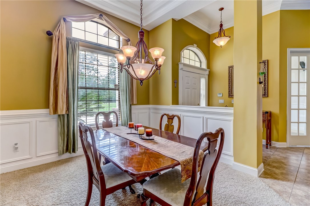 96411 Blackrock Road Yulee, FL 32097 - Photo 6 of 34 a view of a dining room with furniture and a large window
