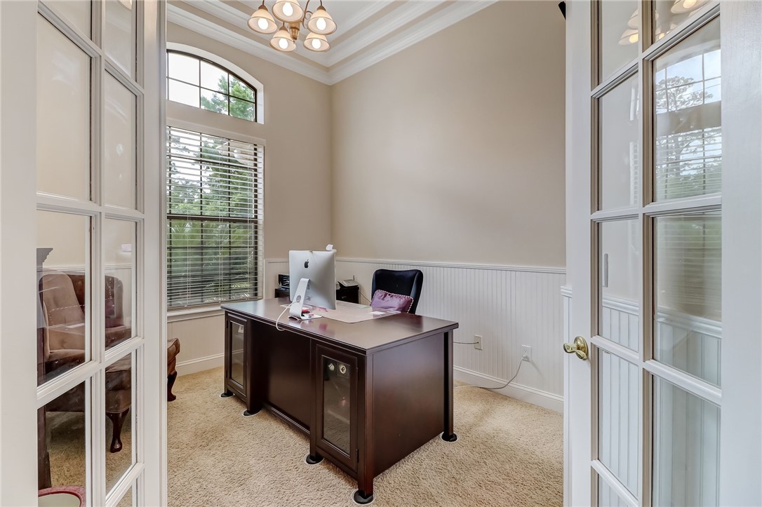 96411 Blackrock Road Yulee, FL 32097 - Photo 7 of 34 a view of a workspace with furniture and a window