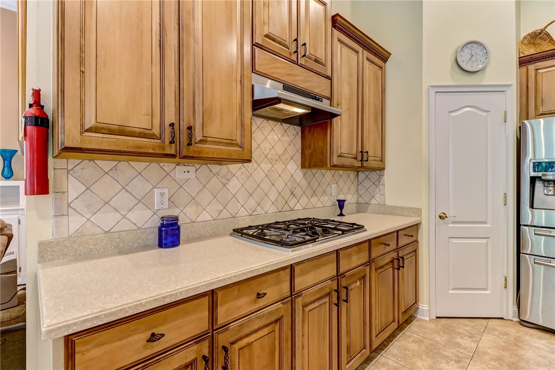 96411 Blackrock Road Yulee, FL 32097 - Photo 10 of 34 a kitchen with stainless steel appliances a cabinets and a stove top oven