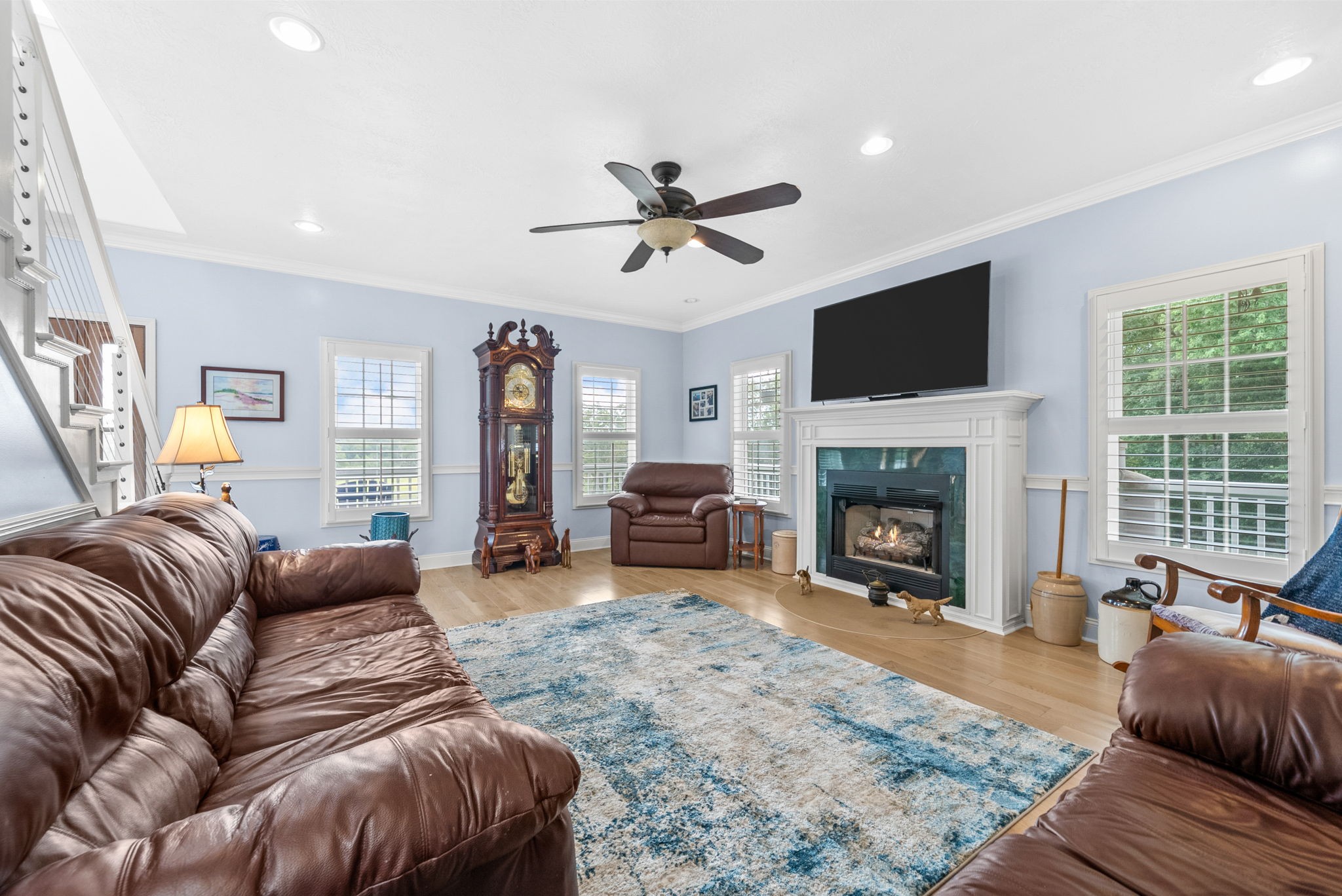 3989 Cadiz Road Bumpus Mills, TN 37028 - Photo 14 of 97 a living room with furniture a fireplace and a flat screen tv