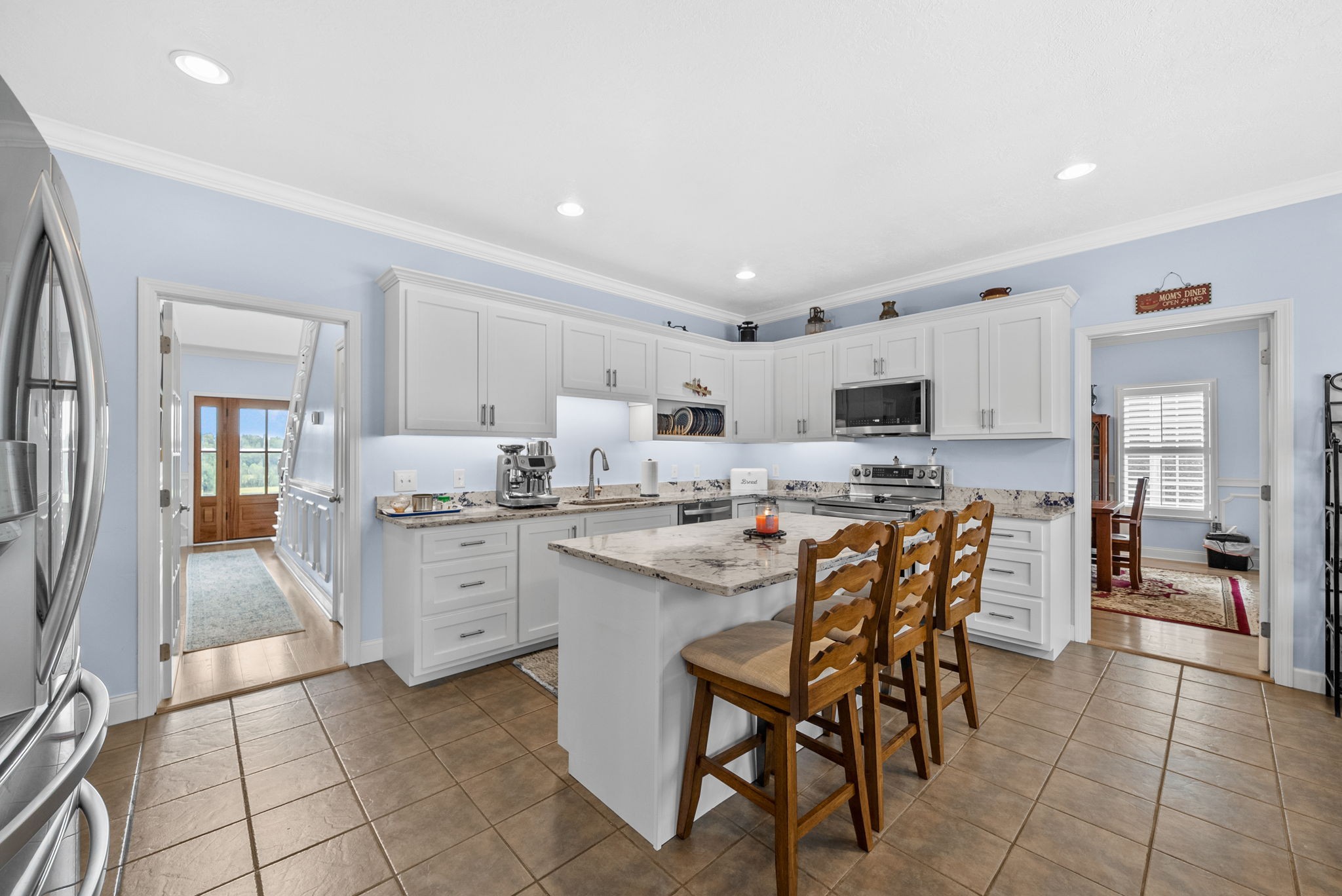 3989 Cadiz Road Bumpus Mills, TN 37028 - Photo 19 of 97 a kitchen with appliances a sink and cabinets