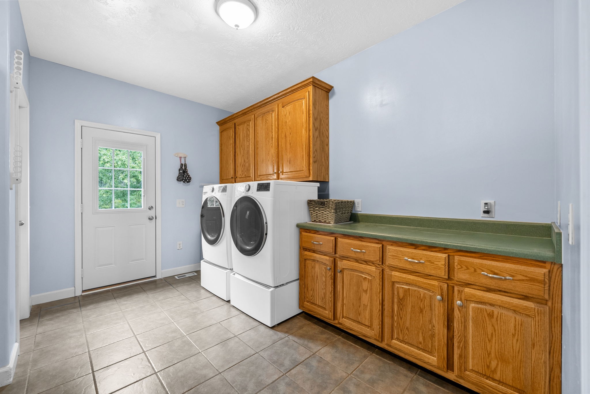 3989 Cadiz Road Bumpus Mills, TN 37028 - Photo 25 of 97 a utility room with sink dryer and washer