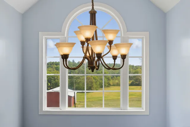 a bathroom with a sink a mirror and a shower