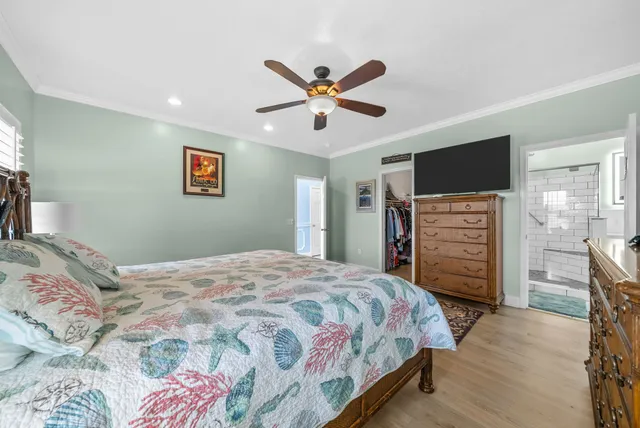 a bedroom with a bed a table and a fireplace