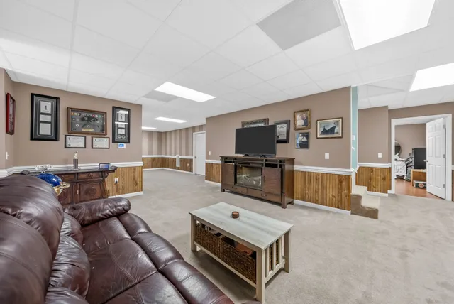 a view of a grassy field with trees