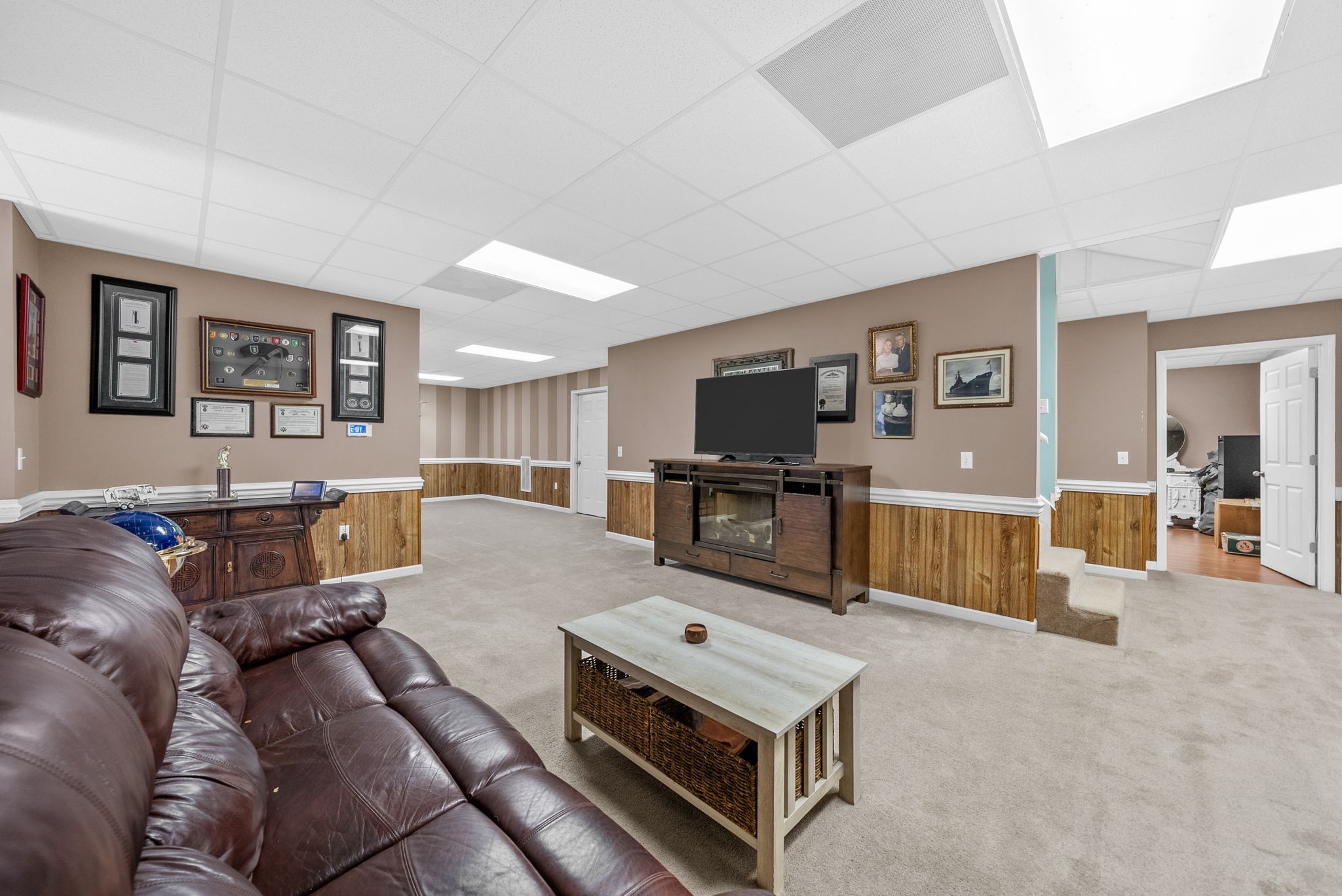 3989 Cadiz Road Bumpus Mills, TN 37028 - Photo 46 of 97 a living room with furniture and a flat screen tv