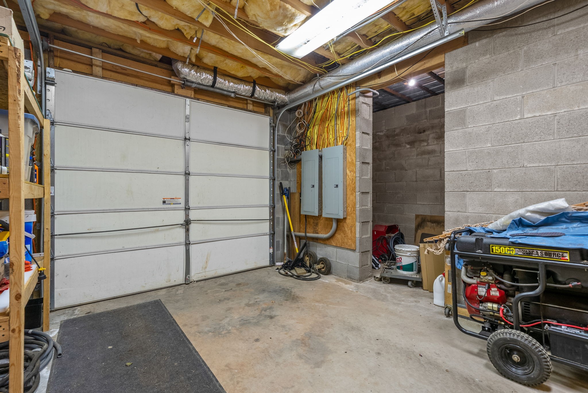 3989 Cadiz Road Bumpus Mills, TN 37028 - Photo 51 of 97 a view of garage with clothes