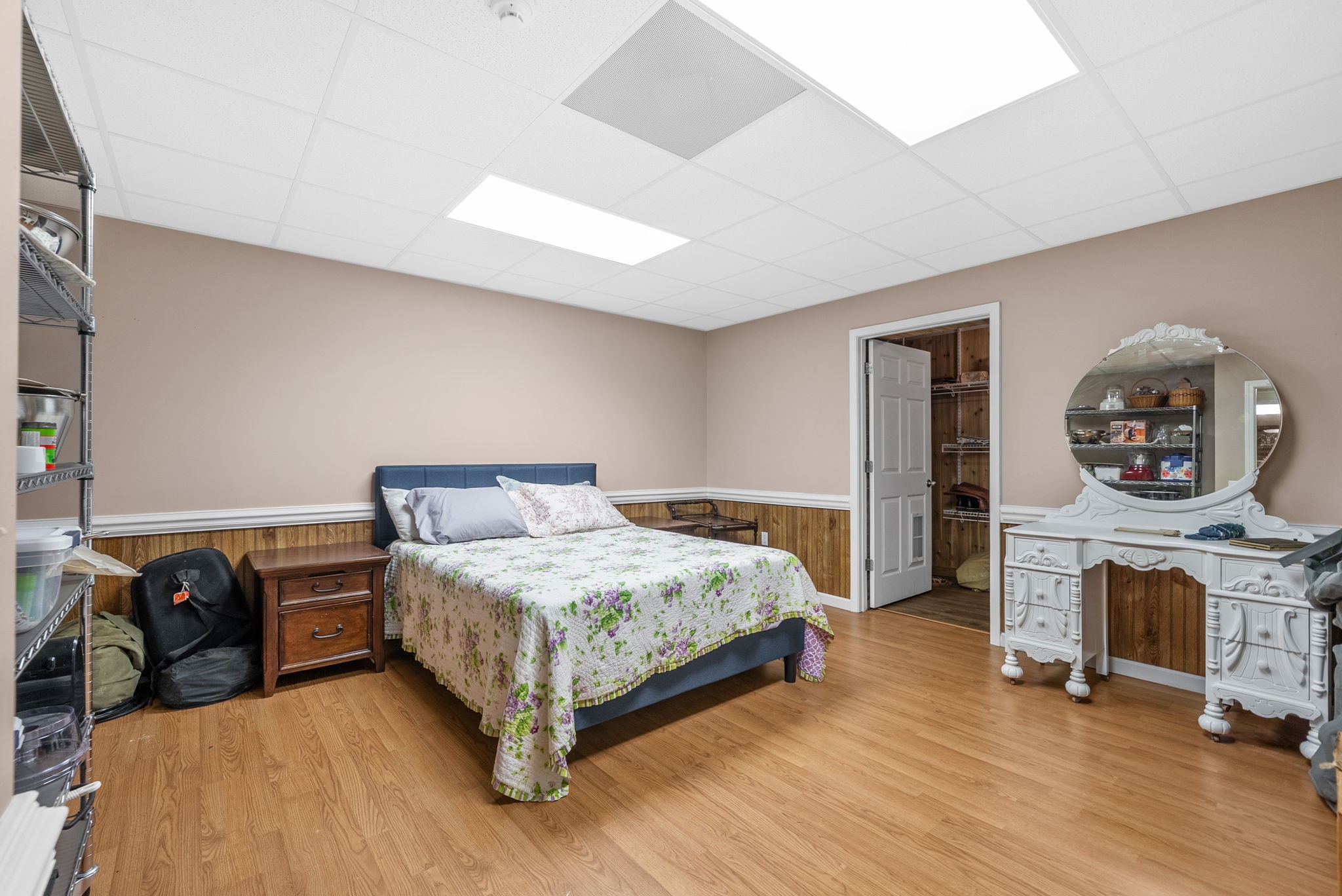 3989 Cadiz Road Bumpus Mills, TN 37028 - Photo 55 of 97 a bedroom with a bed a table and a fireplace