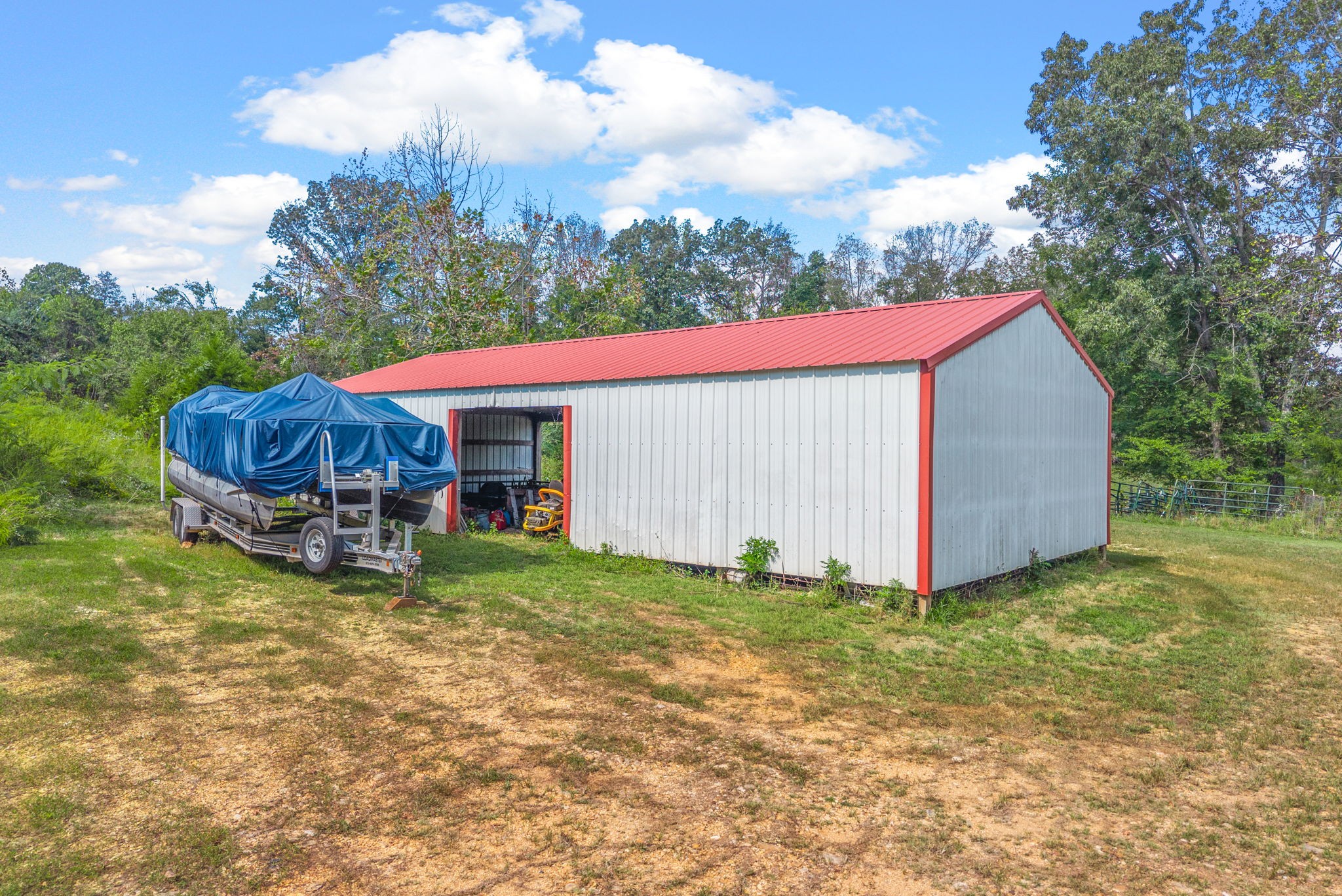 3989 Cadiz Road Bumpus Mills, TN 37028 - Photo 73 of 97 a view of a house with backyard and sitting area