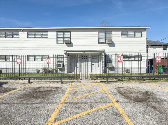 a front view of building with a garden