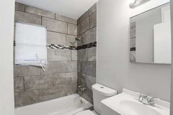 a bathroom with a shower and a toilet