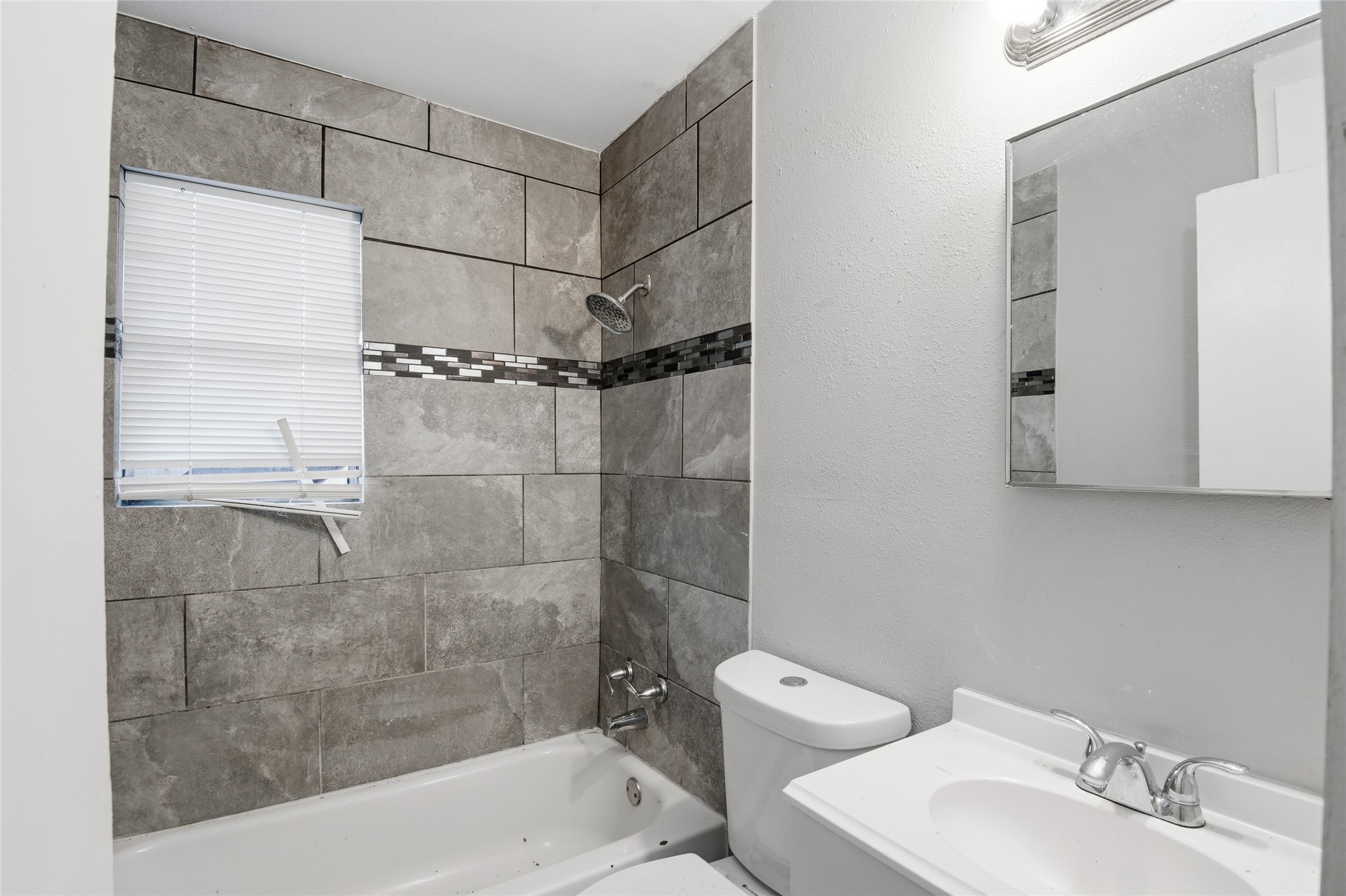 5010 Ennis Street, Unit 3 Houston, TX 77004 - Photo 12 of 12 a bathroom with a shower and a toilet