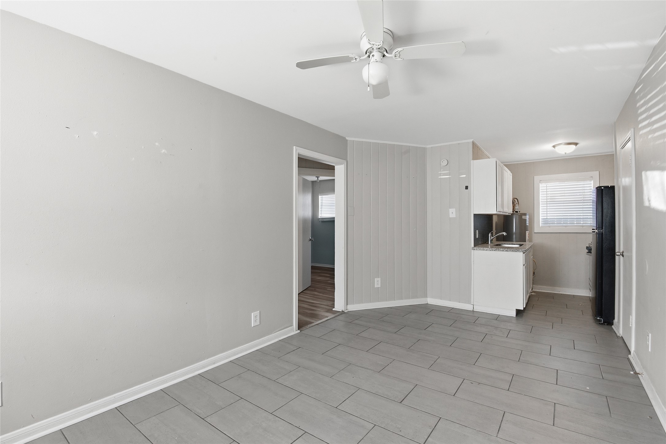 5010 Ennis Street, Unit 3 Houston, TX 77004 - Photo 4 of 12 a view of a kitchen with a sink and a refrigerator