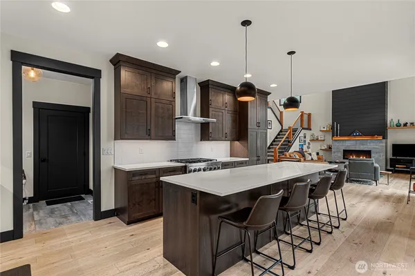 a view of a kitchen with kitchen island dining table and chairs