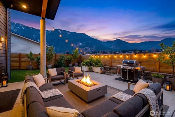 a outdoor living space with furniture and city view