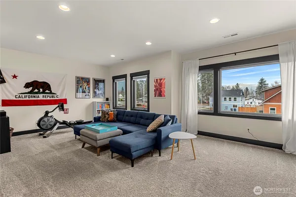 a living room with furniture and a large window