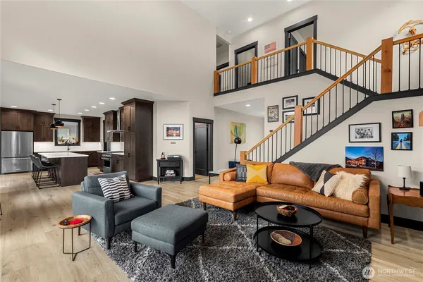a living room with furniture ceiling fan and a rug