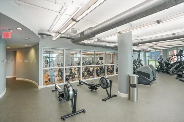 a room with dining table and entryway