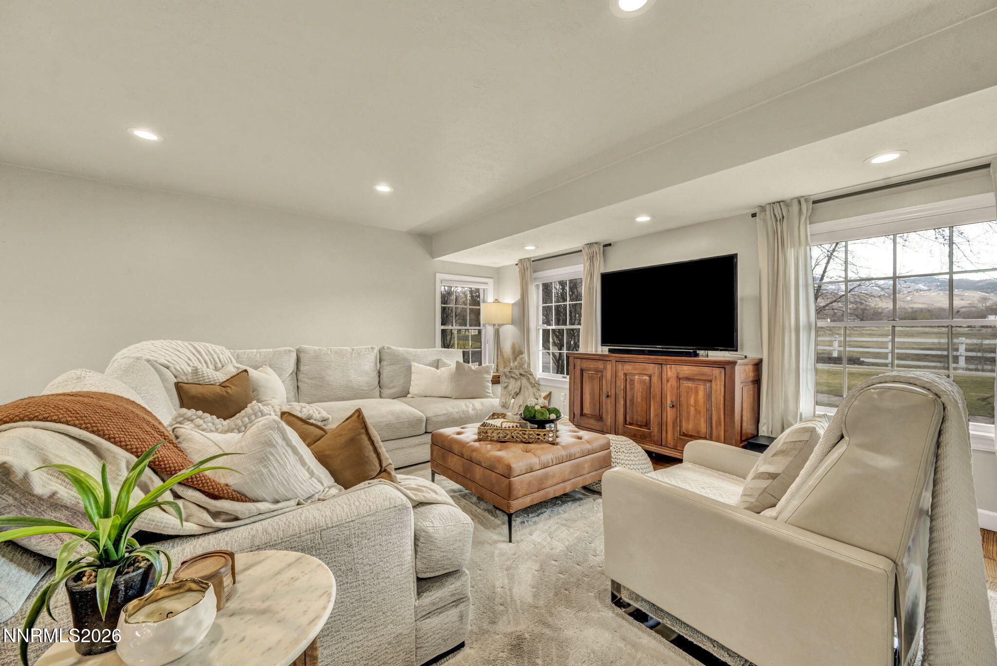 2501 Holcomb Ranch Lane Reno, NV 89511 - Photo 58 of 94 a living room with furniture and a flat screen tv