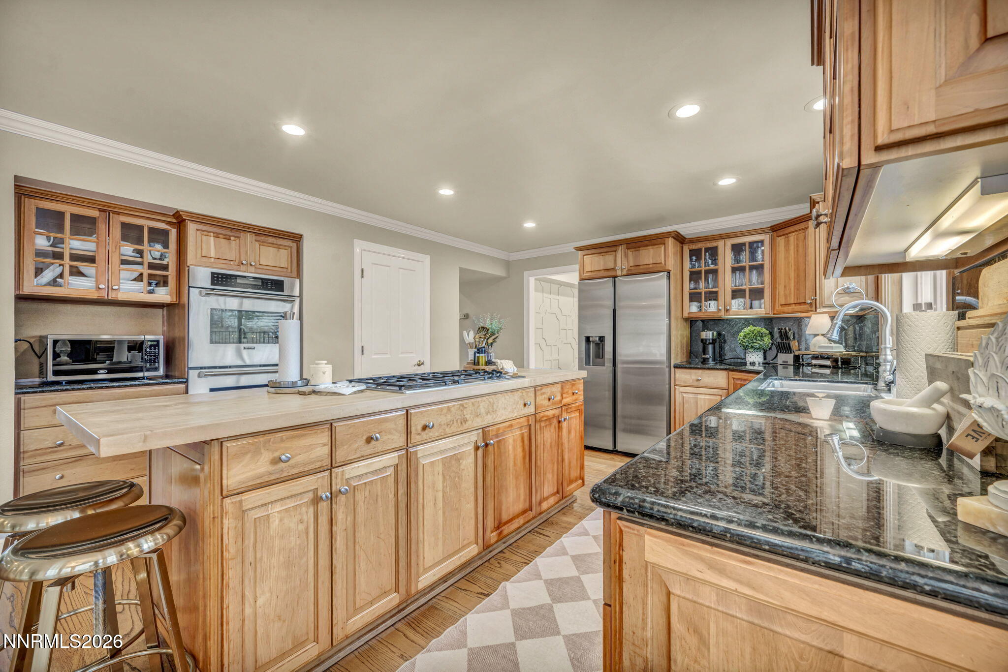 2501 Holcomb Ranch Lane Reno, NV 89511 - Photo 61 of 94 a large kitchen with granite countertop a large counter top appliances and cabinets