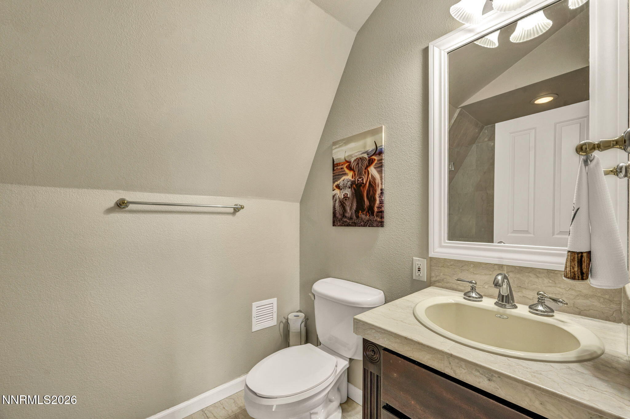 2501 Holcomb Ranch Lane Reno, NV 89511 - Photo 75 of 94 a bathroom with a sink a toilet and mirror