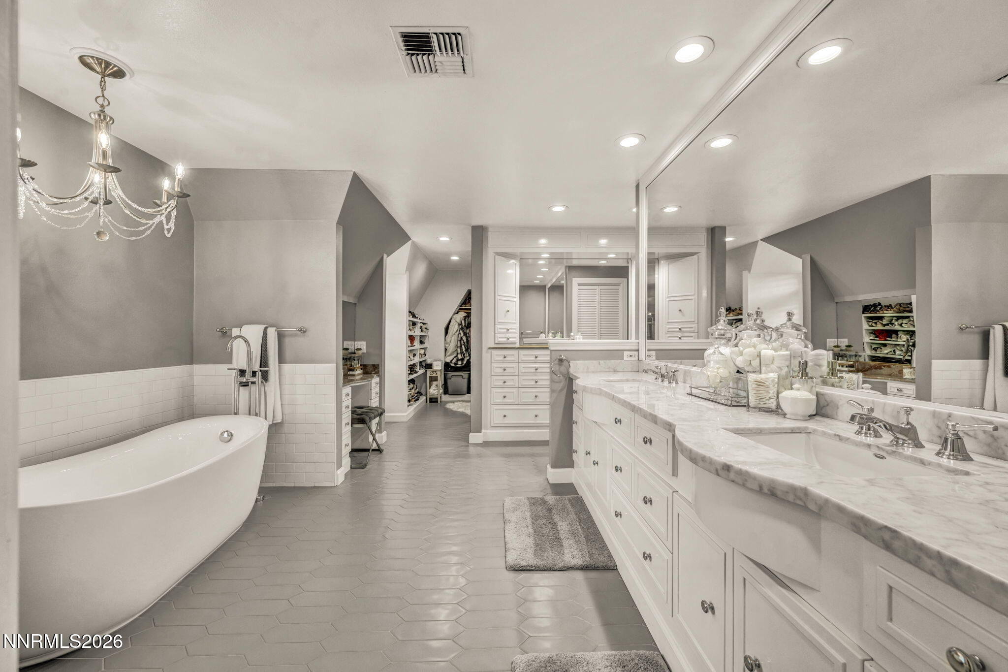 2501 Holcomb Ranch Lane Reno, NV 89511 - Photo 80 of 94 a large bathroom with double vanity sinks a large mirror and a bathtub