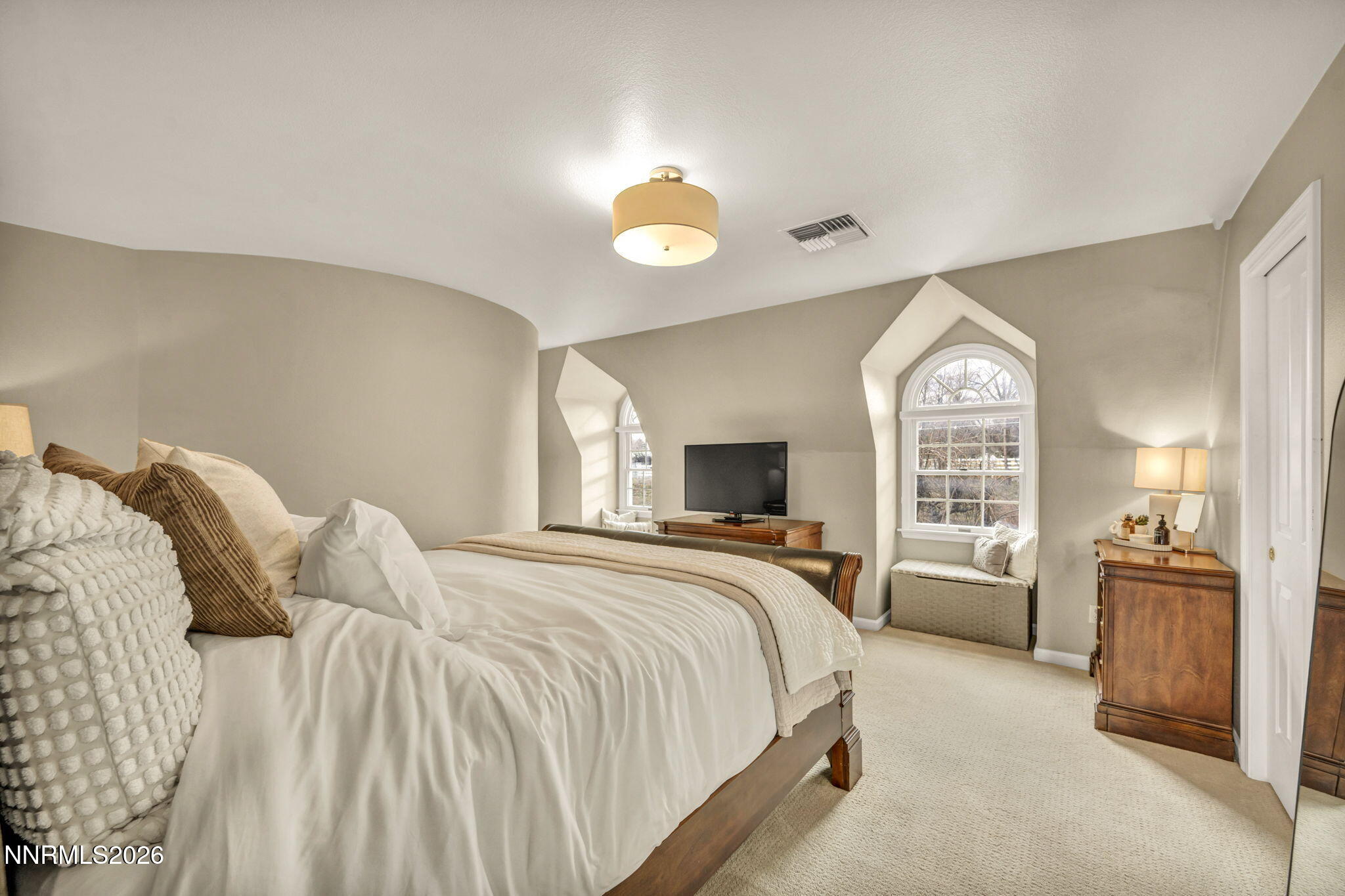2501 Holcomb Ranch Lane Reno, NV 89511 - Photo 87 of 94 a bedroom with a bed and a large window
