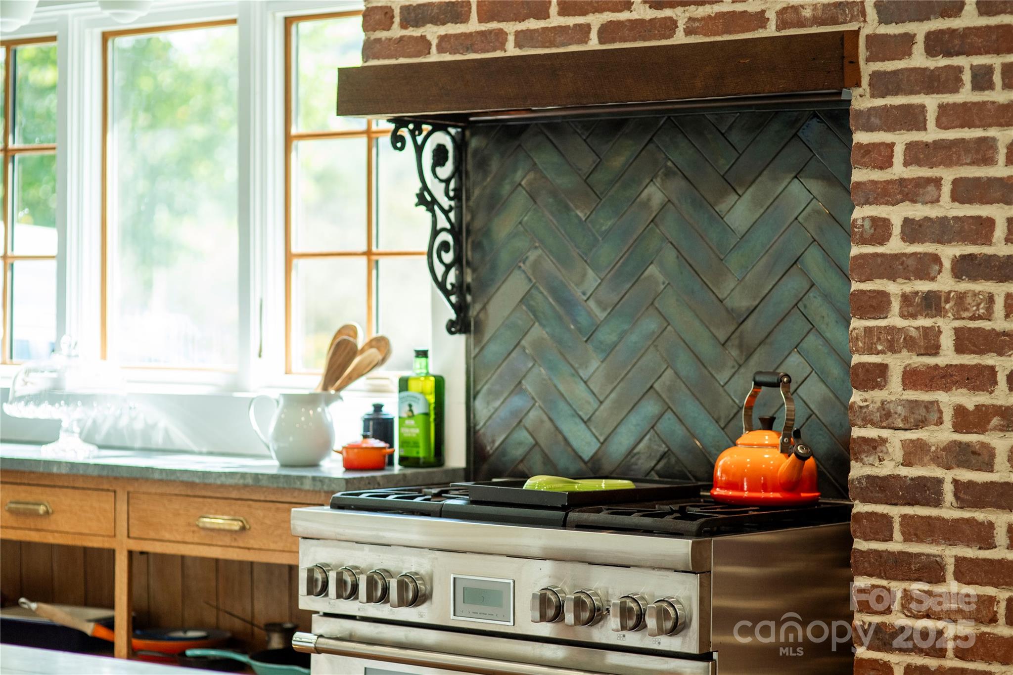 505 North Country Club Road Brevard, NC 28712 - Photo 13 of 48 a kitchen with stainless steel appliances wooden floor and a sink