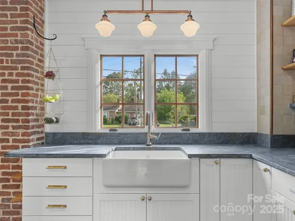 a kitchen with a refrigerator and cabinets